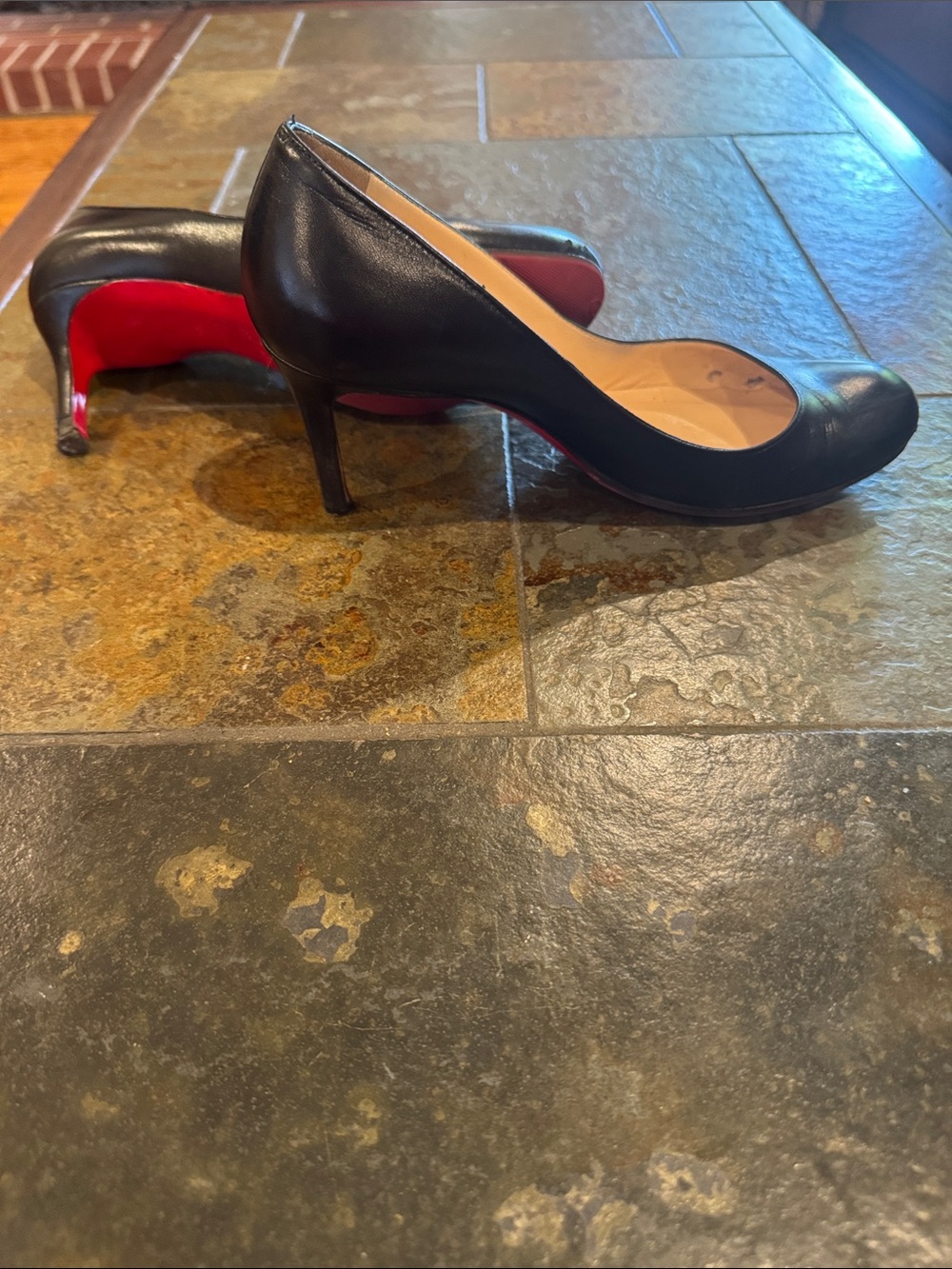 Classic Christian Louboutin Black Leather Stiletto Pumps with Red Sole